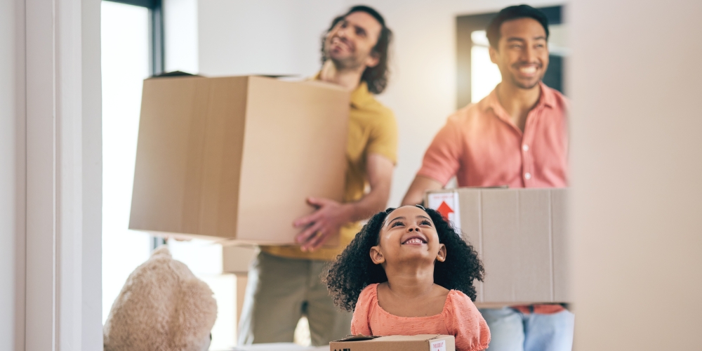 A couple and their daughter moving into a new home